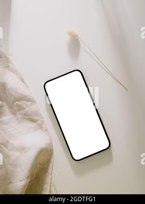 Smartphone mockup, Phone with blank screen template. Flat lay, Minimalist styled. Stock Photo