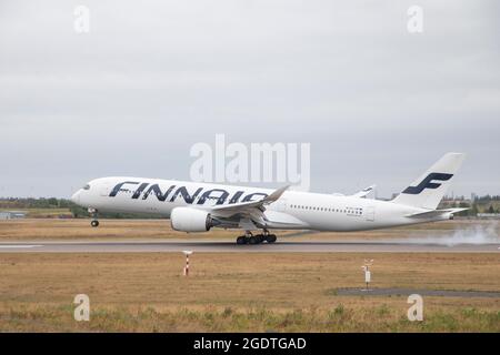 Finnair's Airbus A350 plane landing in Helsinki airport Stock Photo