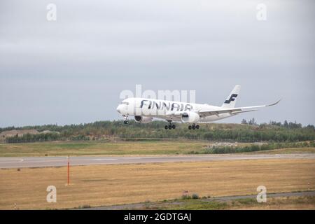 Finnair's Airbus A350 plane landing in Helsinki airport Stock Photo