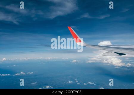 red winglet in graduated dark blue sky Stock Photo