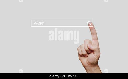Search bar with work word and man hand presses search button on computer touch screen Stock Photo