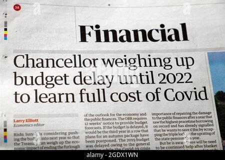 'Chancellor weighing up budget delay until 2022 to learn full cost of Covid' Guardian Financial newspaper headline article 16 July 2021 London UK Stock Photo