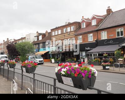 View looking along The Broadway shopping high street in Hatch End North London Stock Photo