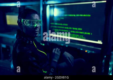 Cyber hacker breaks into databases to obtain information using a computer. Cybercrime and data security concept. Stock Photo