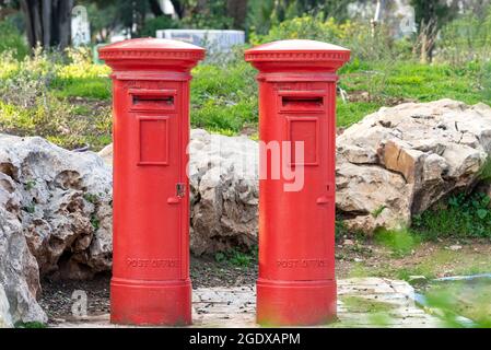 Red mailboxes, Israel. Two old mailboxes on the street of Jerusalem. Stock Photo