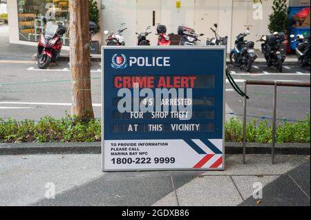 07.11.2019, Singapore, Republic of Singapore, Asia - Sign with the inscription Police Crime Alert informs about arrests of 45 people for shop theft. Stock Photo