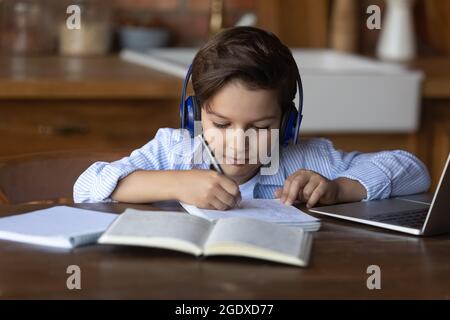 Smart small child study online on computer Stock Photo