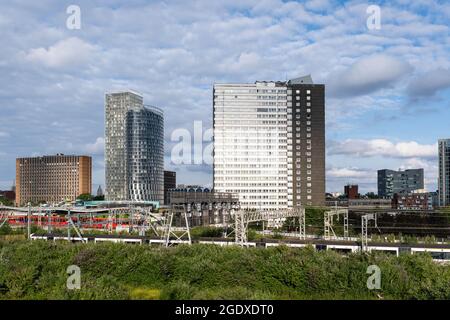 A view of modern and old tower blocks by the railway line in Stratford, Newham, East London Stock Photo