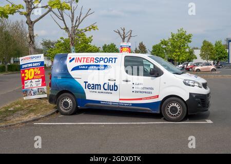 LA FLECHE, FRANCE - Jul 03, 2021: A van with INTERSPORT brand and logo parked on the streets of La Fleche, France Stock Photo