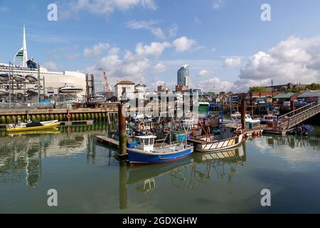 08-12-2021 Portsmouth, Hampshire, UK The Camber dock in Old Portsmouth on a calm summers day with fishing bots docked Stock Photo