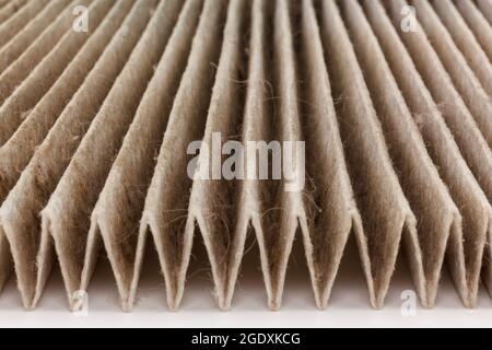 Close up macro very dirty used air filter background. Old dirty air filter car. Stock Photo