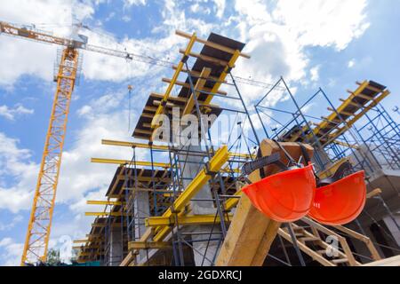 Construction helmets at a construction site. Construction helmet for head protection. Overalls. Helmets Stock Photo