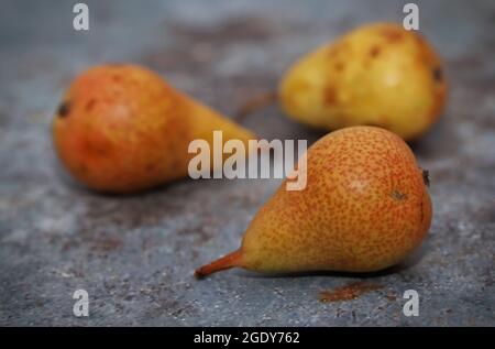 Ripe pears on rustic table Stock Photo