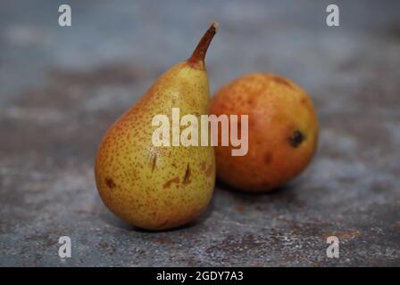 Ripe pears on rustic table Stock Photo