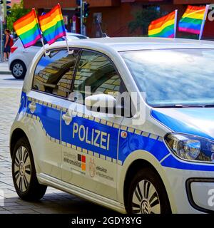Braunschweig, Germany, August 14, 2021: Police car decorated with flags in the colors of the rainbow, on the edge of a march for CSD Christopher Stree Stock Photo