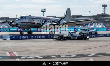 Berlin, Germany. 15th Aug, 2021. Motorsport: Formula E World Championship, ePrix 2021, race at the former Tempelhof Airport. Norman Nato of the ROKiT Venturi Racing team drives past an aircraft. Nato wins a race day for the first time. Credit: Andreas Gora/dpa/Alamy Live News Stock Photo