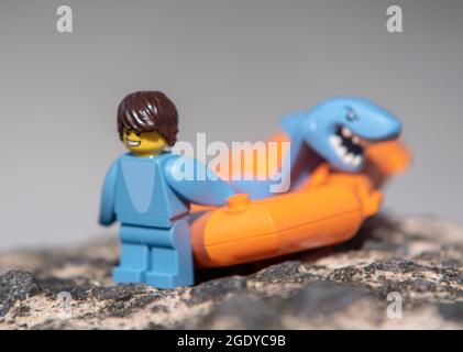 LEGO shark minifigure on the beach Stock Photo