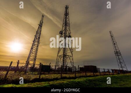 The three Telecom masts on Cleeve Common, Cheltenham Spa, Gloucestershire, England Stock Photo