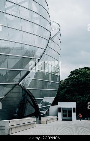 Vertical shot of the modern building wall with graffiti Stock Photo - Alamy