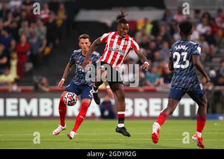 London, UK. 14th Aug, 2021. Ivan Toney of Brentford lays the ball off during the Premier League match between Brentford and Arsenal at Brentford Community Stadium, London, England on 13 August 2021. Photo by Ken Sparks. Editorial use only, license required for commercial use. No use in betting, games or a single club/league/player publications. Credit: UK Sports Pics Ltd/Alamy Live News Stock Photo