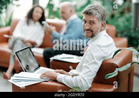 business man works with documents in the office . Stock Photo