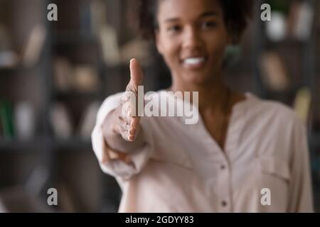 Close up of ethnic woman stretch hand for handshake Stock Photo