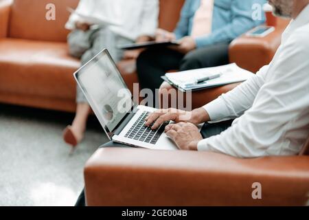 business man works on a laptop in the office. close-up. Stock Photo