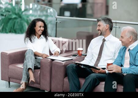 business woman discussing a new contact with her business partne Stock Photo