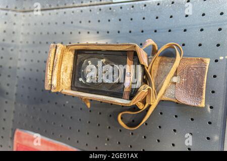 PARIS, FRANCE - Mar 24, 2020: A closeup shot of an old analog camera in its leather case,  from a war photographer Stock Photo
