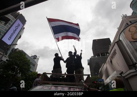 Bangkok, Thailand. 01st Jan, 2000. A protester waving a Thailand flag on top of a car during clashes. Thai anti-government protesters clashed with police as they demonstrated against government's failure to handle the coronavirus outbreaks. Credit: SOPA Images Limited/Alamy Live News Stock Photo