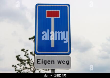 Sign dead end street with undersign 'own road' or eigen weg in Dutch language Stock Photo