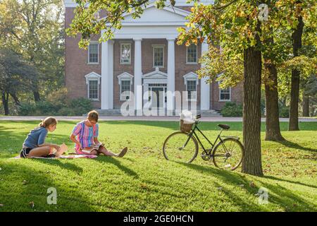 Wisconsin Beloit College Middle College school campus,students Indian mound grass,bicycle riders biking bike, Stock Photo
