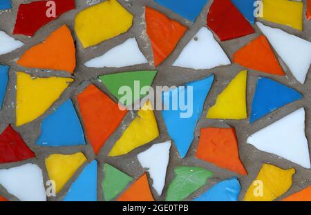 Vintage colorful mosaic background. Mosaic pattern close up in retro style. Colorful polygons background. Stock Photo