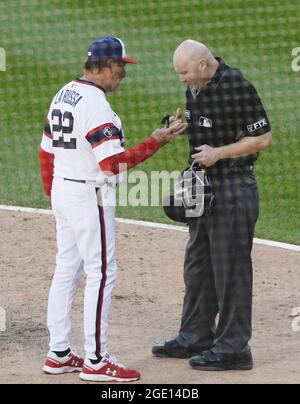 White Sox manager Tony La Russa (22) and Cubs manager David Ross (3) share  a moment before the start of a game at Wrigley Field on Aug. 6, 2021.  (Photo by Chris