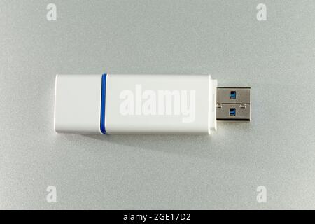 USB Dongle Stick Flash Drive closeup on aluminum background Stock Photo
