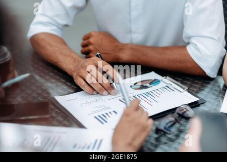 group of specialists analyzing financial data. close-up. Stock Photo