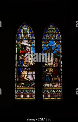 Salvador, Bahia, Brazil - October 28, 2015: Colorful stained glass windows filled with art from a Catholic church. Salvador Bahia Brazil. Stock Photo