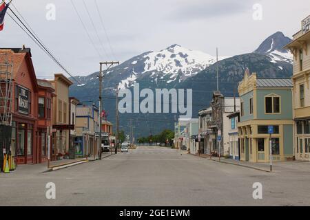 View down main street of Skagway and various buildings in town Stock Photo