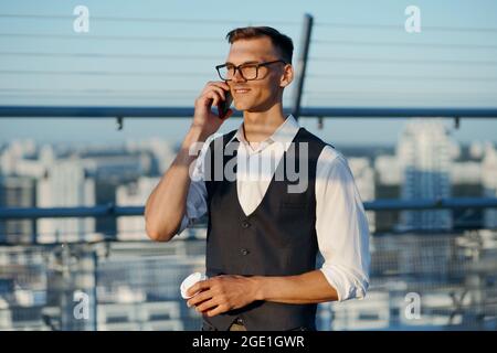 young entrepreneur talking on his smartphone. close-up. Stock Photo