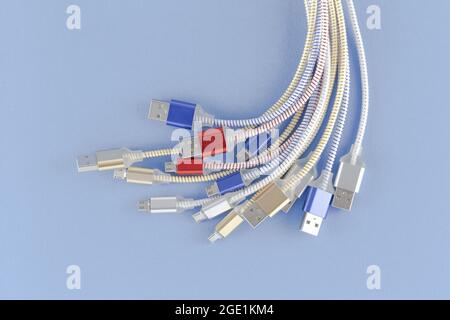 Heap a Lot Of USB (Universal Serial Bus)  cables Connectors plugs universal standart for computer different types cables and Ports peripheral. Close u Stock Photo