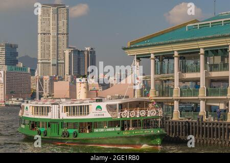 The 'Shining Star', a reproduction 3rd Generation Star Ferry, carryies tourists on a pleasure cruise on Victoria Harbour, Hong Kong (60s retro look) Stock Photo