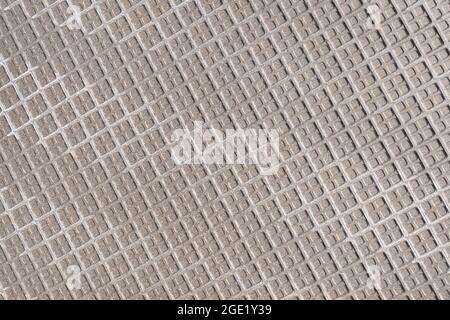 Rough back side of a tile with pattern of squares Stock Photo