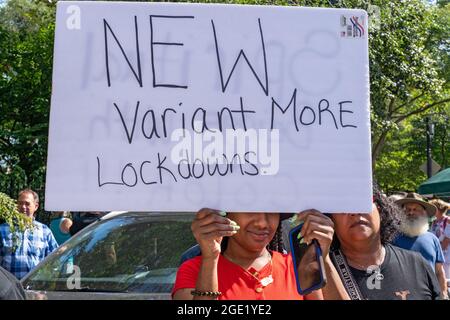 New York, United States. 15th Aug, 2021. A woman holds a sign that says New Variant More Lockdown at a Republicans Rally against COVID vaccine mandates outside Gracie Mansion in New York City.NYC vaccine mandate starts Monday, August 16th; Proof of coronavirus (COVID-19) vaccination will be required to attend indoor restaurants, gyms, and entertainment venues with enforcement of the mandate to begin on September 13th. Credit: SOPA Images Limited/Alamy Live News Stock Photo