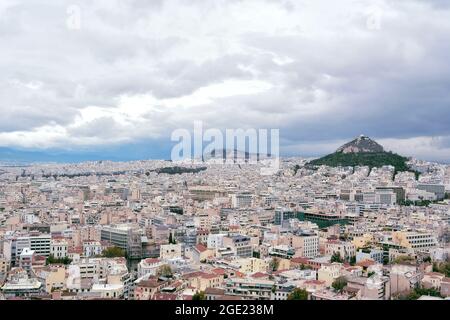 Athens, Greece - October 24, 2015: Aerial view from Aropolis on the center and Mount Lycabettus. Limestone hill known as Lycabettos, Lykabettos or Lyk Stock Photo