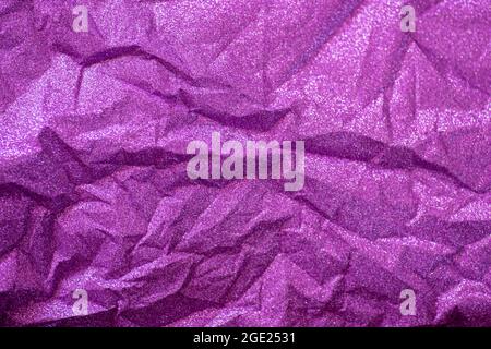 Purpled wrinkled paper shot from directly above Stock Photo