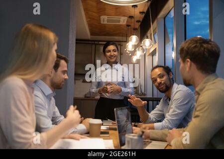 Staff members participate in workshop working until late in office Stock Photo