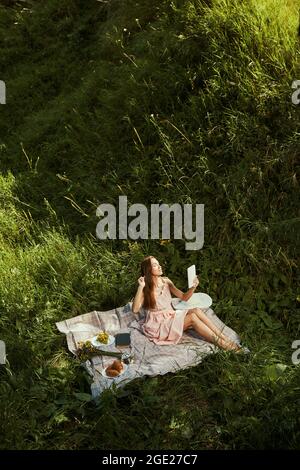 Beautiful lady combing her hair before the photo session Stock Photo