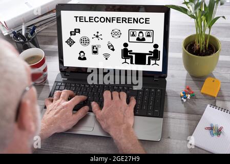 Teleconference concept shown on a laptop used by a man Stock Photo