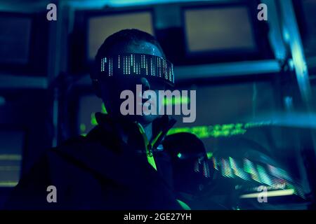 Cyber hacker breaks into databases to obtain information using a computer. Cybercrime and data security concept. Stock Photo