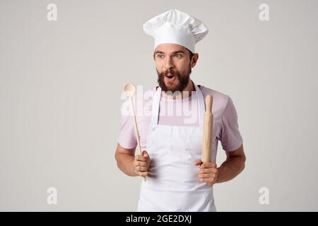 male chef in an apron walking professional cooking restaurant Stock Photo